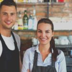 young-man-and-woman-working-at-cafe-picture-id807295236-2